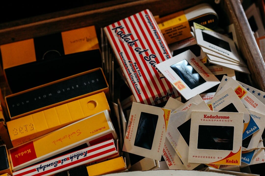 Vintage film reel and cinema projector on a wooden archive shelf